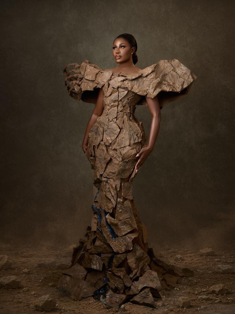 Nana Akua Addo in the "Living Stone" textured mermaid gown with oversized puffed shoulders.