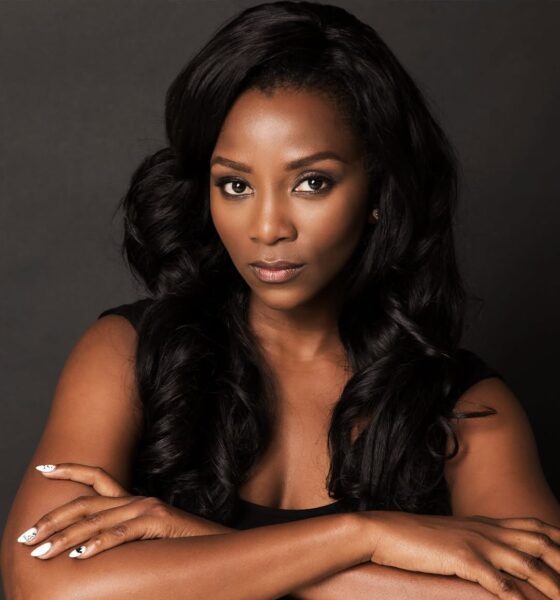 A portrait of Nigerian actress Genevieve Nnaji with long wavy hair and white manicured nails, confirmed as part of the BBC Wahala cast.