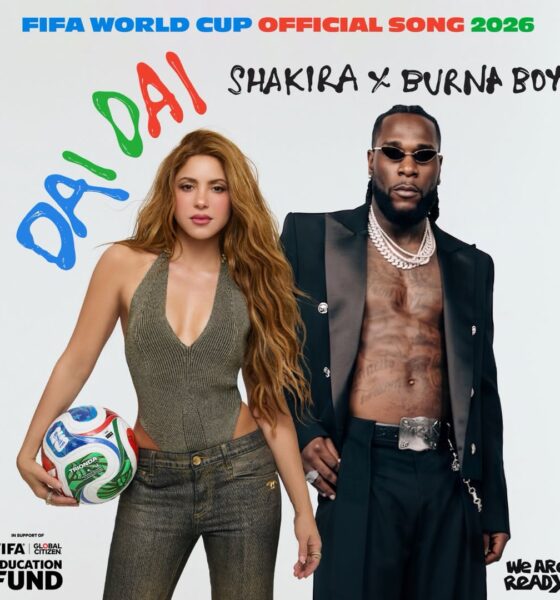 Official single cover for "Dai Dai" featuring Shakira holding a football and Burna Boy in an open black suit jacket and diamond chains.