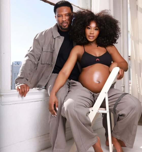 Nollywood actress Sharon Ooja and husband Ugo Nwoke pose together during her maternity shoot, Sharon wearing a black bralette and grey cargo trousers showcasing her baby bump