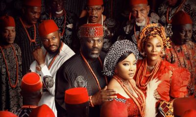 Movie poster for ‘The Serpent’s Gift’ featuring Linda Ejiofor, Stan Nze, Tina Mba, and Daniel Etim Effiong in traditional Igbo attire including red caps and coral beads.