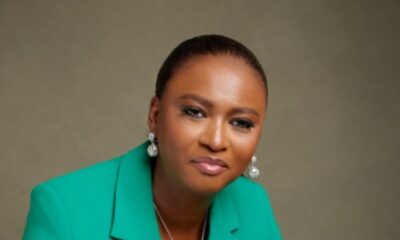 Studio portrait of Elohor Aiboni, the Executive Vice President and Country Chair for Shell Nigeria, wearing a bright green blazer, white top, and silver jewellery against a neutral studio background.