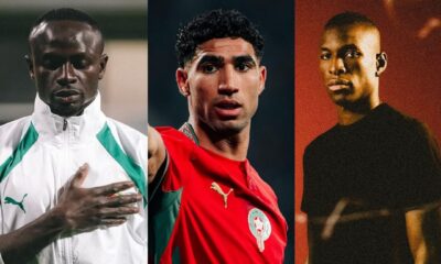 Senegal's Sadio Mané with his hand over his heart, Morocco's Achraf Hakimi in his red national team jersey, and Chelsea's Nicolas Jackson in a black t-shirt against a red background.