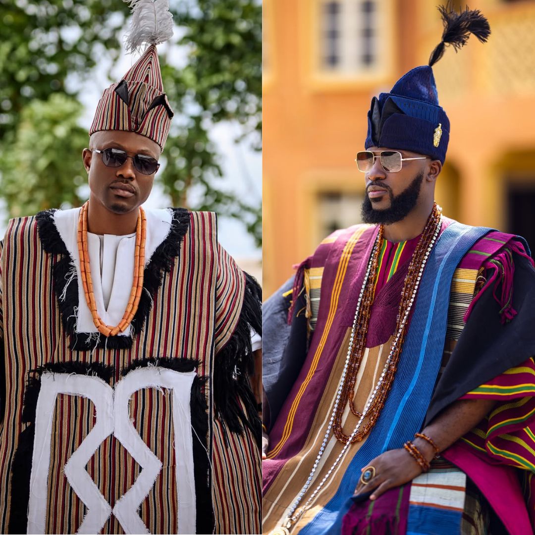 A side-by-side photo showcasing Vector in a fringed geometric striped robe and Akin Faminu in a vibrant layered wine and blue Aso-Oke ensemble with a tall tasseled fila at Ojude Oba 2026.