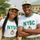 An AI-generated concept image portraying optimistic male and female Nigerian youth posing at an orientation camp, symbolising the Federal Executive Council's landmark 2026 NYSC restructuring initiative