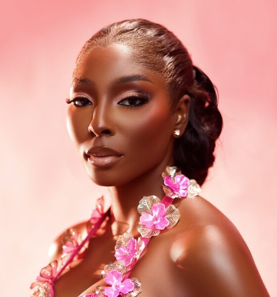 Close-up beauty portrait of Tamunosoye Karibi George showcasing a pink beaded neckline with prominent sculptural 3D pink and silver metallic flowers.