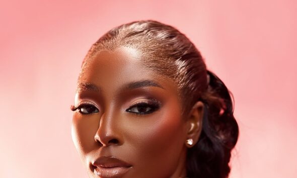 Close-up beauty portrait of Tamunosoye Karibi George showcasing a pink beaded neckline with prominent sculptural 3D pink and silver metallic flowers.