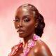 Close-up beauty portrait of Tamunosoye Karibi George showcasing a pink beaded neckline with prominent sculptural 3D pink and silver metallic flowers.