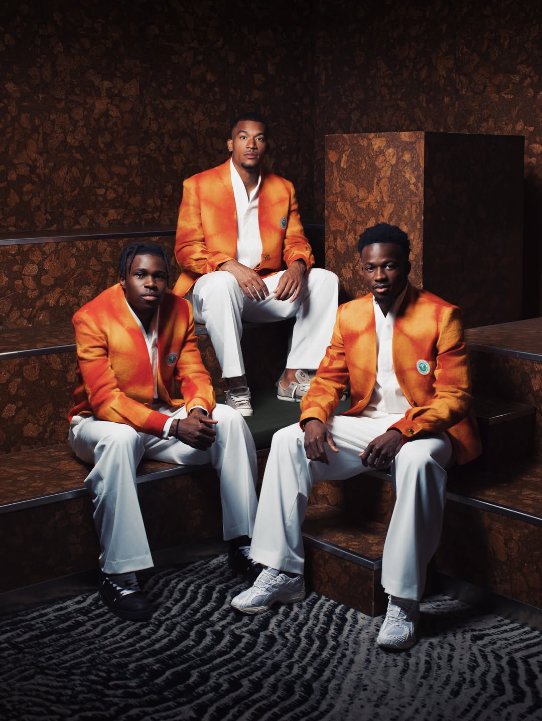 Côte d’Ivoire Arrive in Orange Tie-Dye Jackets Wit