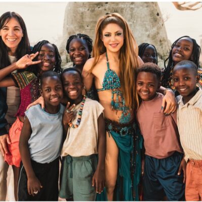 Colombian singer Shakira posing for a group photo with Uganda’s Ghetto Kids on the set of the Dai Dai official 2026 FIFA World Cup anthem music video.