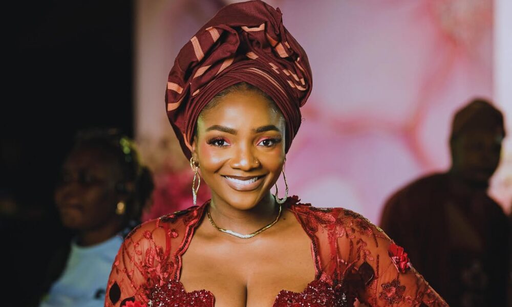 See How Simi Slayed in Burgundy Corset Glam at Her Mother’s 70th ...