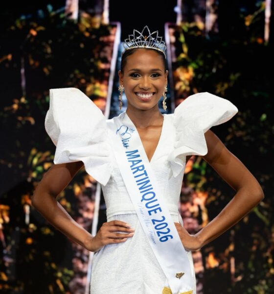 Maureen-Alycia Lucéa-Merlin wearing the Miss Martinique 2026 sash, crown, and gold drop earrings with her hands on her hips.