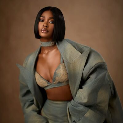 Dede Ashiogwu's BBNaija Season 10 reunion glam featuring a razor-sharp black bob, denim choker, and detailed floral lace on her bralette.