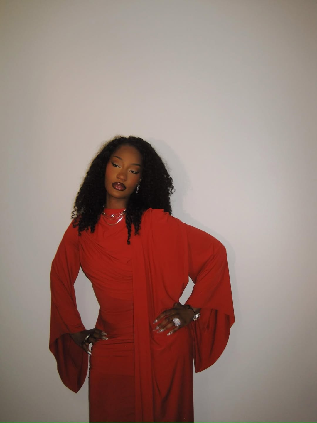 Nigerian singer Tems showcasing her full-length fashion look for the Obama Presidential Center grand opening in Chicago, where she performed her hit single "Me & U".