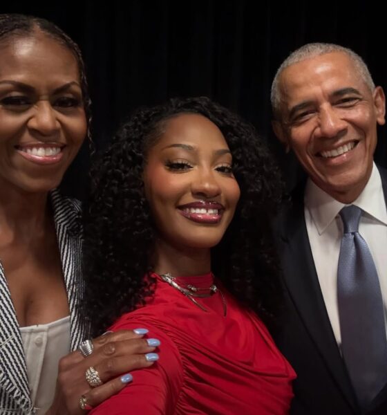 Smiling selfie featuring Michelle Obama, Nigerian musician Tems, and former US President Barack Obama together at the Obama Presidential Center in Chicago.
