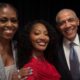 Smiling selfie featuring Michelle Obama, Nigerian musician Tems, and former US President Barack Obama together at the Obama Presidential Center in Chicago.