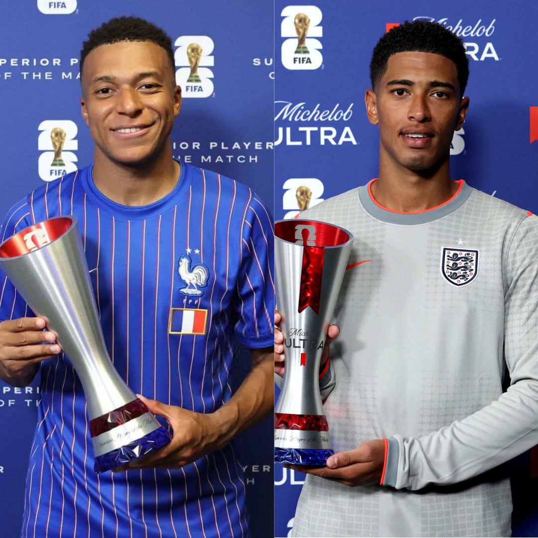 Kylian Mbappé holding the silver FIFA Player of the Match trophy next to Jude Bellingham holding his respective Michelob Ultra Player of the Match award.