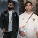 Egypt's Mohamed Salah and Morocco's Achraf Hakimi wearing official national team apparel and tournament passes at the World Cup.