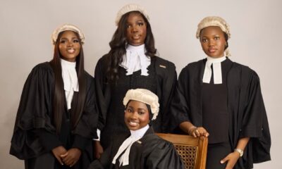 Four female Nigerian lawyers wearing traditional white legal wigs, collared bands, and black barrister gowns during the Call to the Bar ceremony.