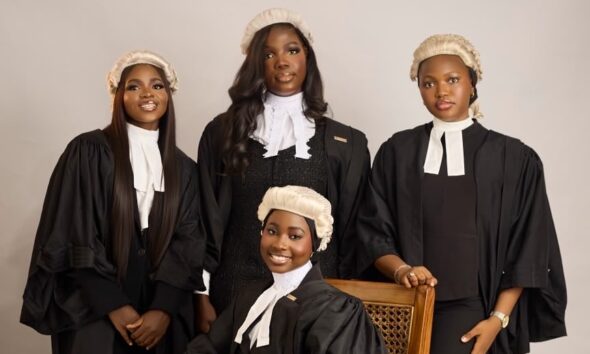 Four female Nigerian lawyers wearing traditional white legal wigs, collared bands, and black barrister gowns during the Call to the Bar ceremony.