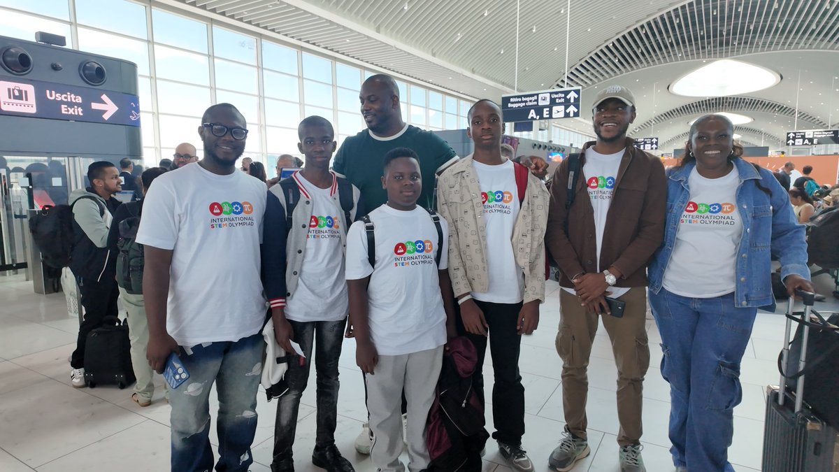 Nigerian students Chimdiebube Onwubiko, Don Anele Munachimso Marvelous, and Egejurum Onyedikachi Ethan with their sponsor Alex Onyia and teachers wearing International STEM Olympiad t-shirts at Rome Airport.