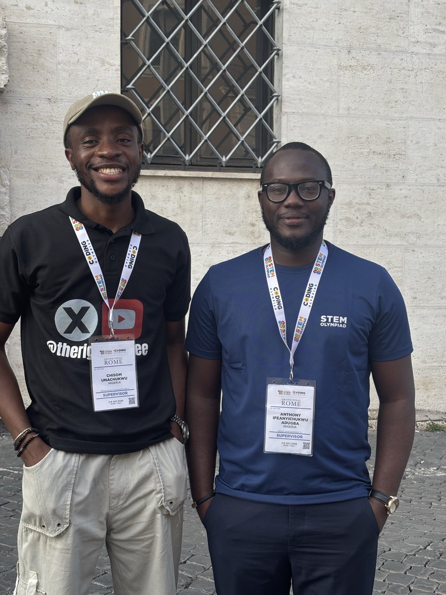 Nigerian teachers Chisom Unachukwu and Anthony Iwegbu wearing official International STEM Olympiad Rome ID badges.