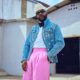 Big Brother Naija host Ebuka Obi-Uchendu wearing a crystal-embellished denim jacket and pink wide-leg trousers by ATAFO, inspired by legendary actor Nkem Owoh, as BBNaija Season 11 premieres.FO as BBNaija Season 11 premieres.