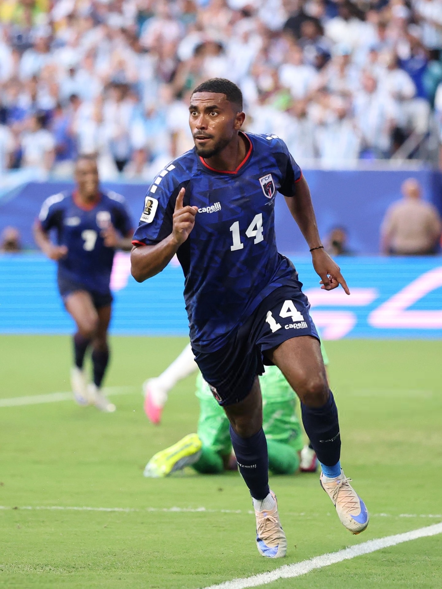 Cabo Verde midfielder Deroy Duarte wearing the number 14 blue jersey running during the match against Argentina.