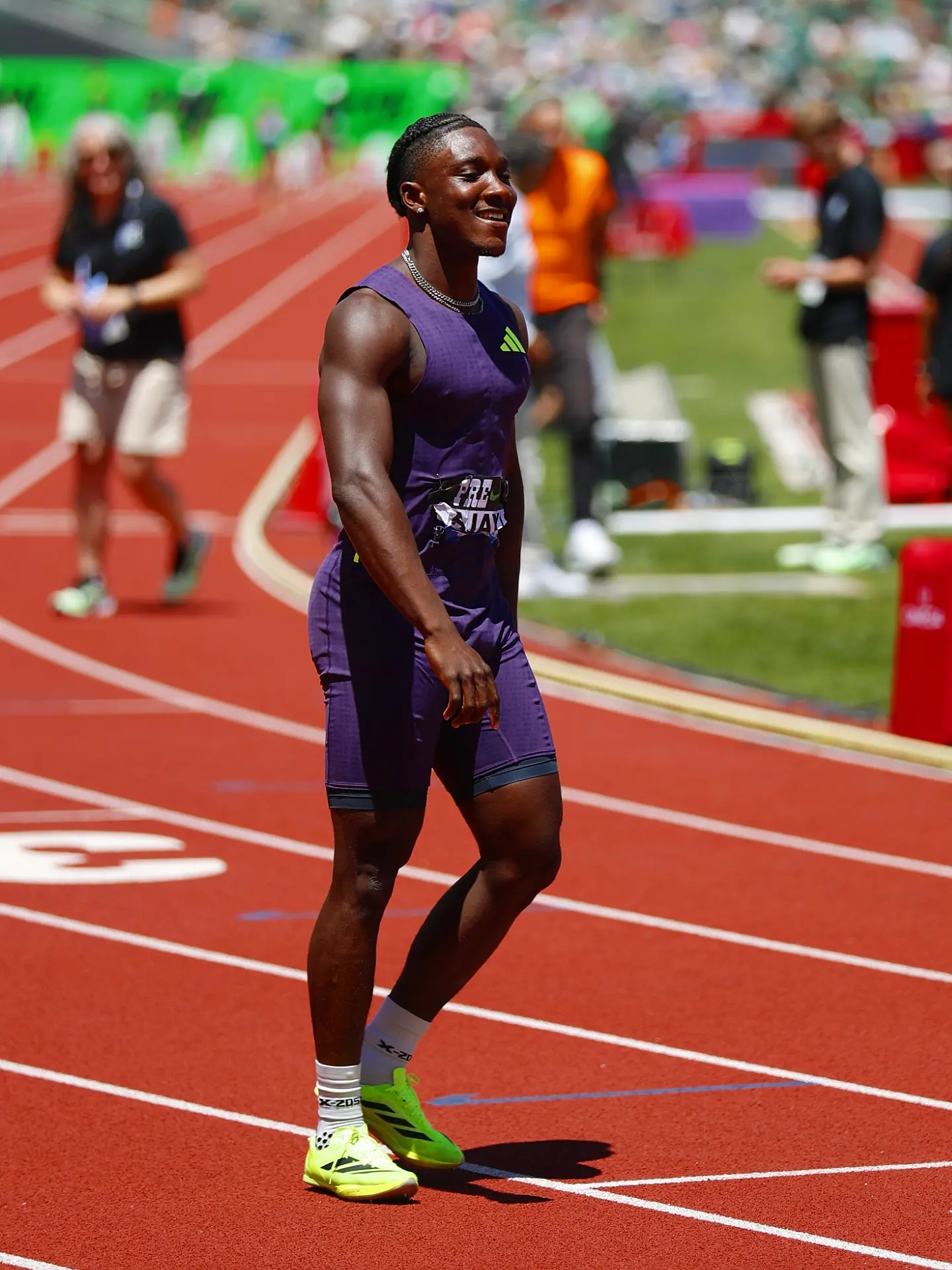 Nigerian track and field athlete Kanyinsola Ajayi walking on the athletics track after his race victory.