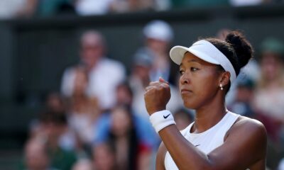 Naomi Osaka pumps her fist celebrating a point against Aryna Sabalenka during her Wimbledon 2026 fourth round match on Centre Court.