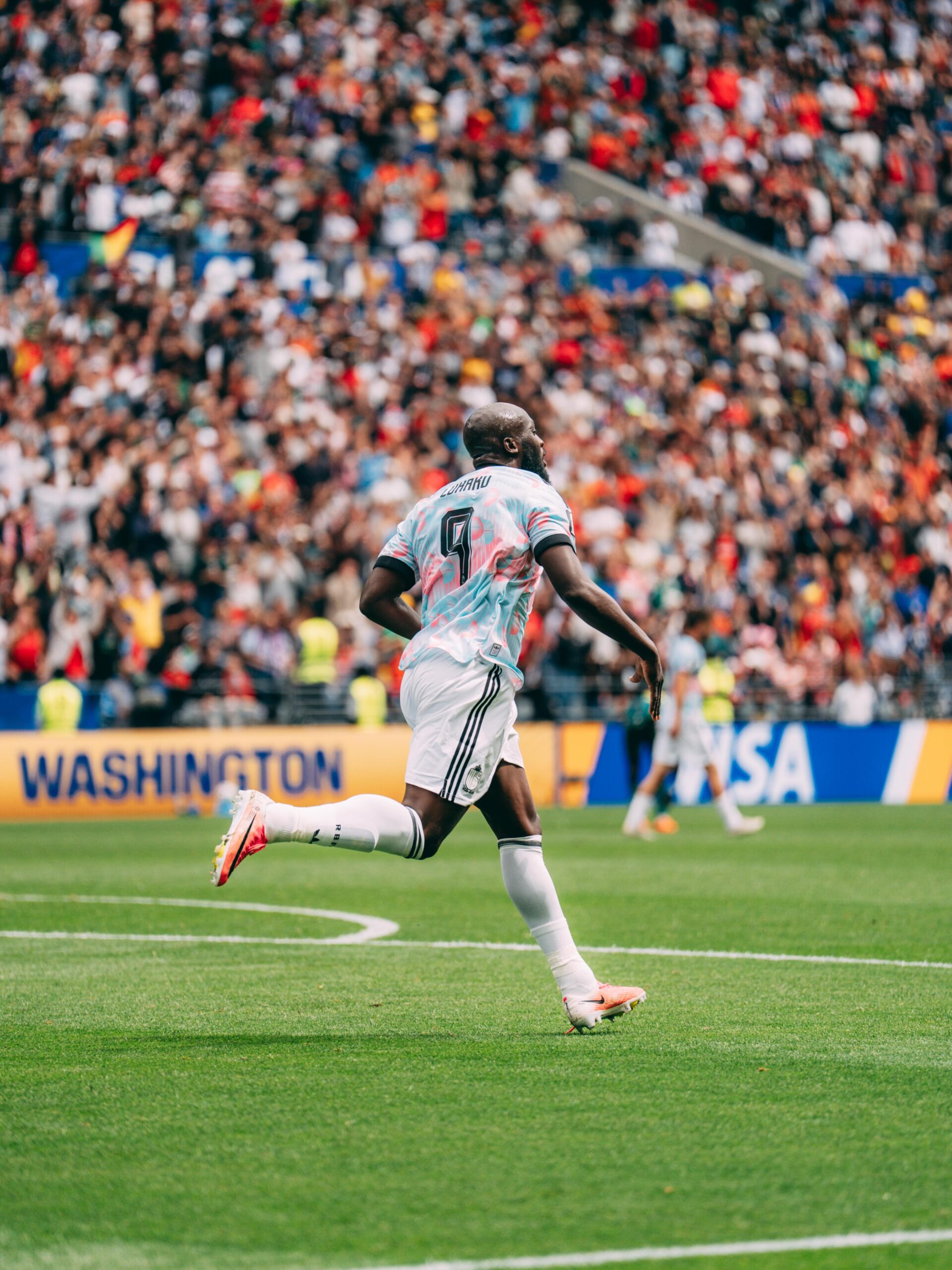 Striker Romelu Lukaku of Congolese descent running on the pitch in celebration during Belgium's 4-1 victory over the USA at the 2026 FIFA World Cup.
