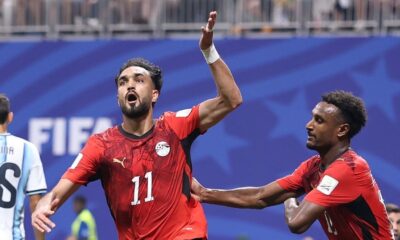 Yasser Ibrahim shouting in celebration after scoring Egypt's opening goal against Argentina with teammate Haissem Hassan.