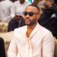 Big Brother Naija Season 10 ("No Loose Guard") finalist Kola Omotosho looking stylish in a pale pink silk shirt and sunglasses at the Big Brother Naija Season 11 press conference in Lagos, Nigeria.