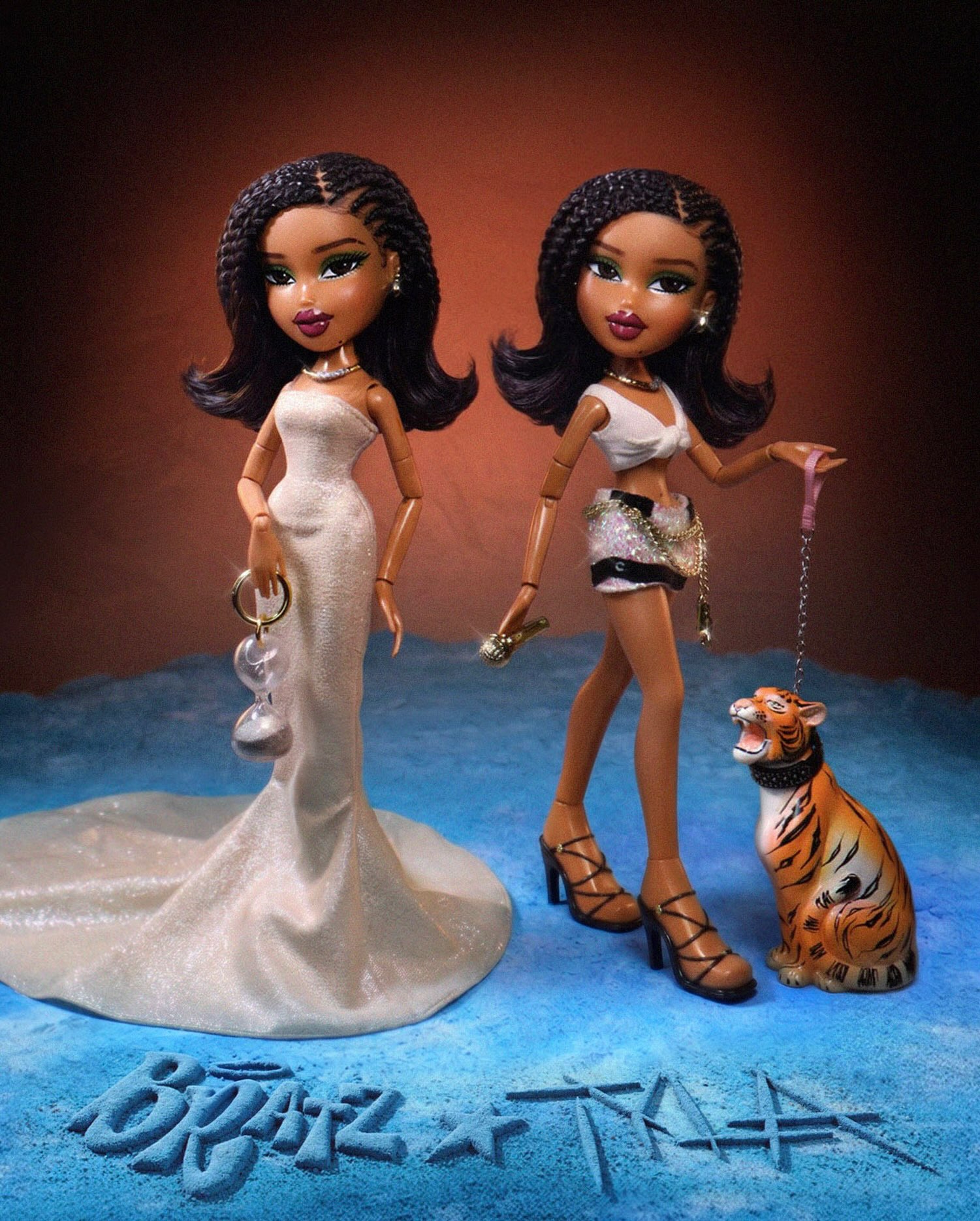 Official Bratz x Tyla dolls featuring her Balmain Met Gala dress with hourglass bag, performance outfit, and pet tiger on a chain.