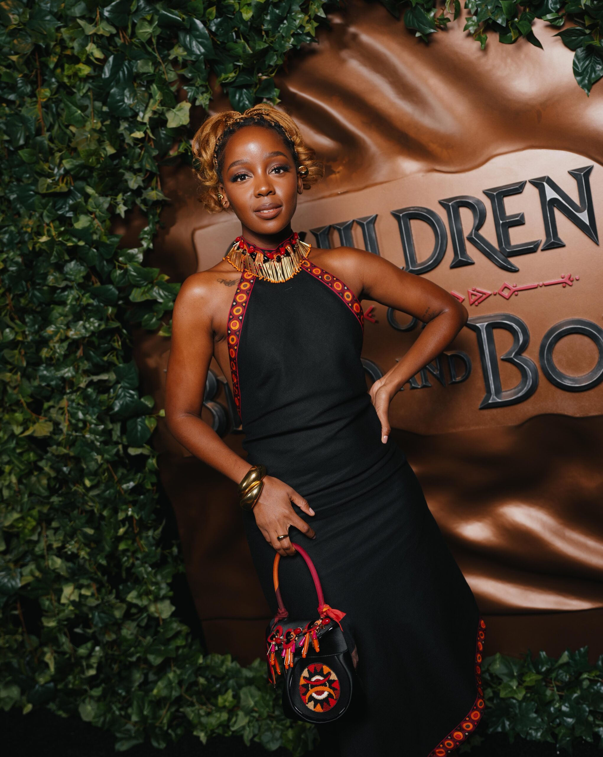Actress Thuso Mbedu wearing a black halterneck gown with embroidered detailing at the Children of Blood and Bone trailer launch in Brooklyn.