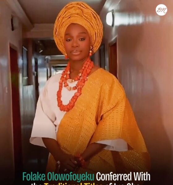 Folake Olowofoyeku wearing a white traditional outfit, gold gele, and coral beads following her chieftaincy conferment as Yeye Oba and Yeye Atayese in Ilesa, Osun State.