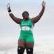 Nigerian shot putter Jessica Oji raising her arms in celebration after securing silver in the women's shot put final at the Glasgow 2026 Commonwealth Games.