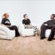 Nana Otedola sitting between Temi Ajibade and Mr Eazi on white armchairs during the Season 5 finale of The How Far Podcast.