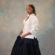 Florence Otedola wearing a structured white shirt and full black skirt reflecting her choice to shed public expectations and performative identity.