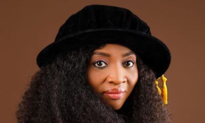 Professor Ogechi Adeola wearing academic doctoral regalia and cap representing the University of Kigali and AD Scientific Index research excellence.