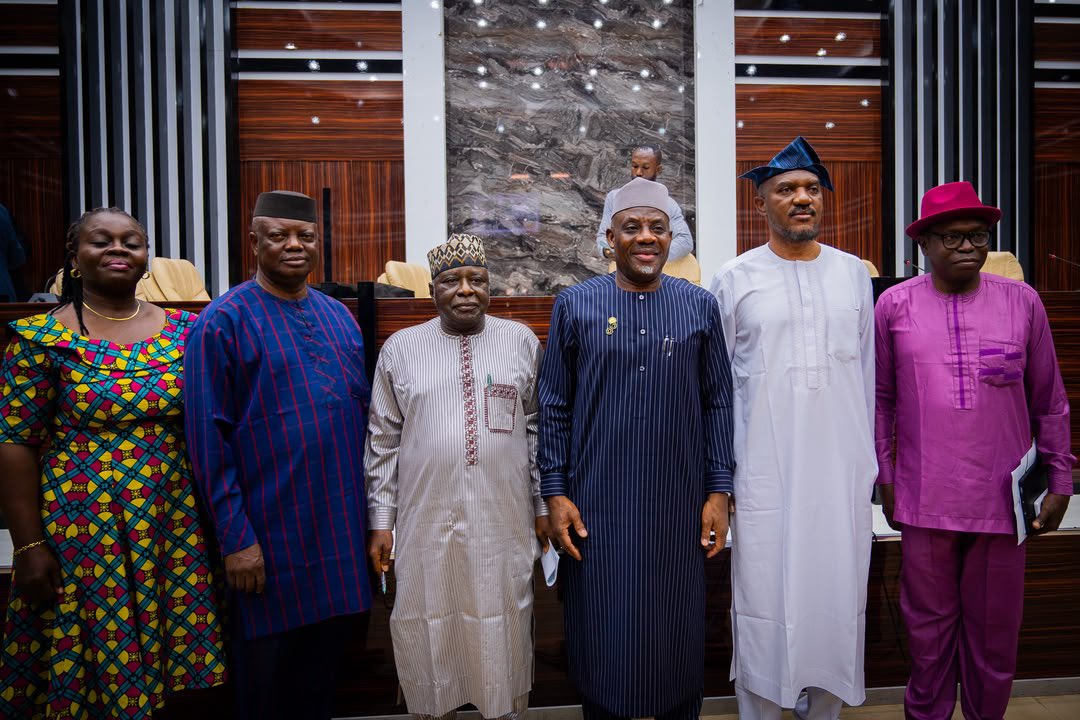 Minister of Education Dr Tunji Alausa standing with members of the Nigeria Education Repository and Databank team following the press briefing.