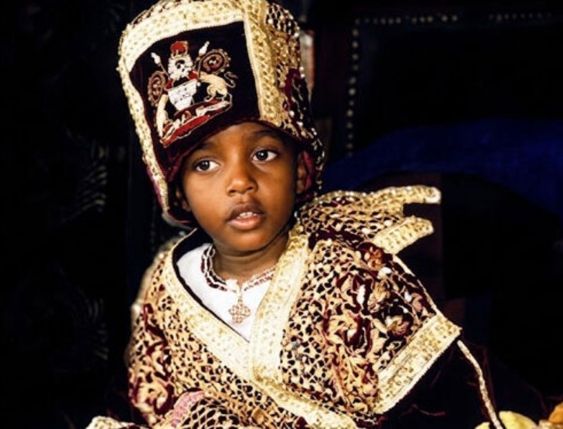 Three-year-old King Oyo Nyimba Kabamba Iguru Rukidi IV wearing traditional royal Tooro coronation regalia and a crown during his 1995 ascension.