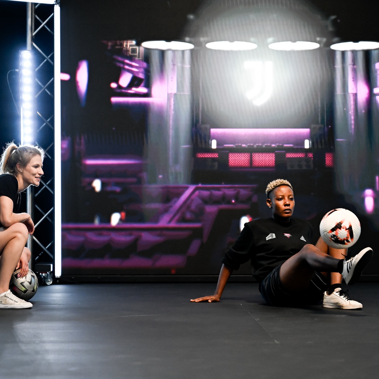 Evelyn Okafor executing a seated ball trick control routine at the World Freestyle Football Championship