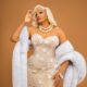Omotola Jalade-Ekeinde in a strapless floral-beaded ivory dress with a platinum blonde retro wave hairstyle and a faux fur wrap for the Lagos premiere of Mother's Love.