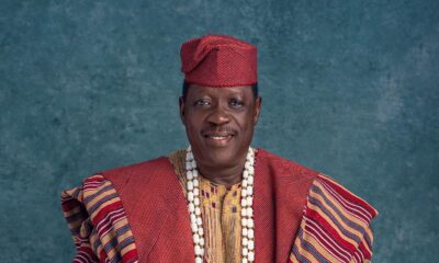 Memorial photo of Nollywood actor Taiwo Hassan Ogogo wearing traditional red Aso-Oke Agbada and white coral beads.