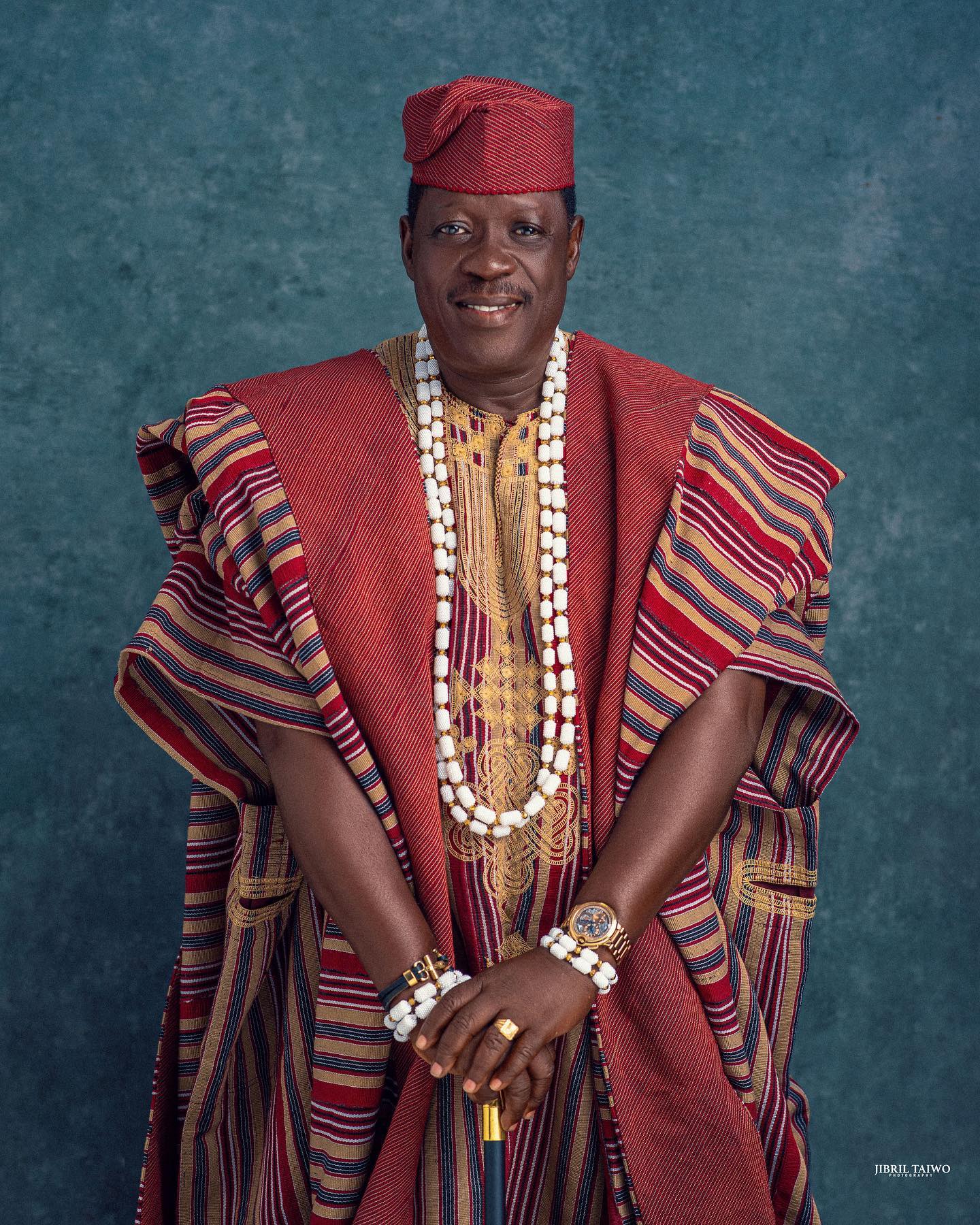 Memorial photo of Nollywood actor Taiwo Hassan Ogogo wearing traditional red Aso-Oke Agbada and white coral beads.