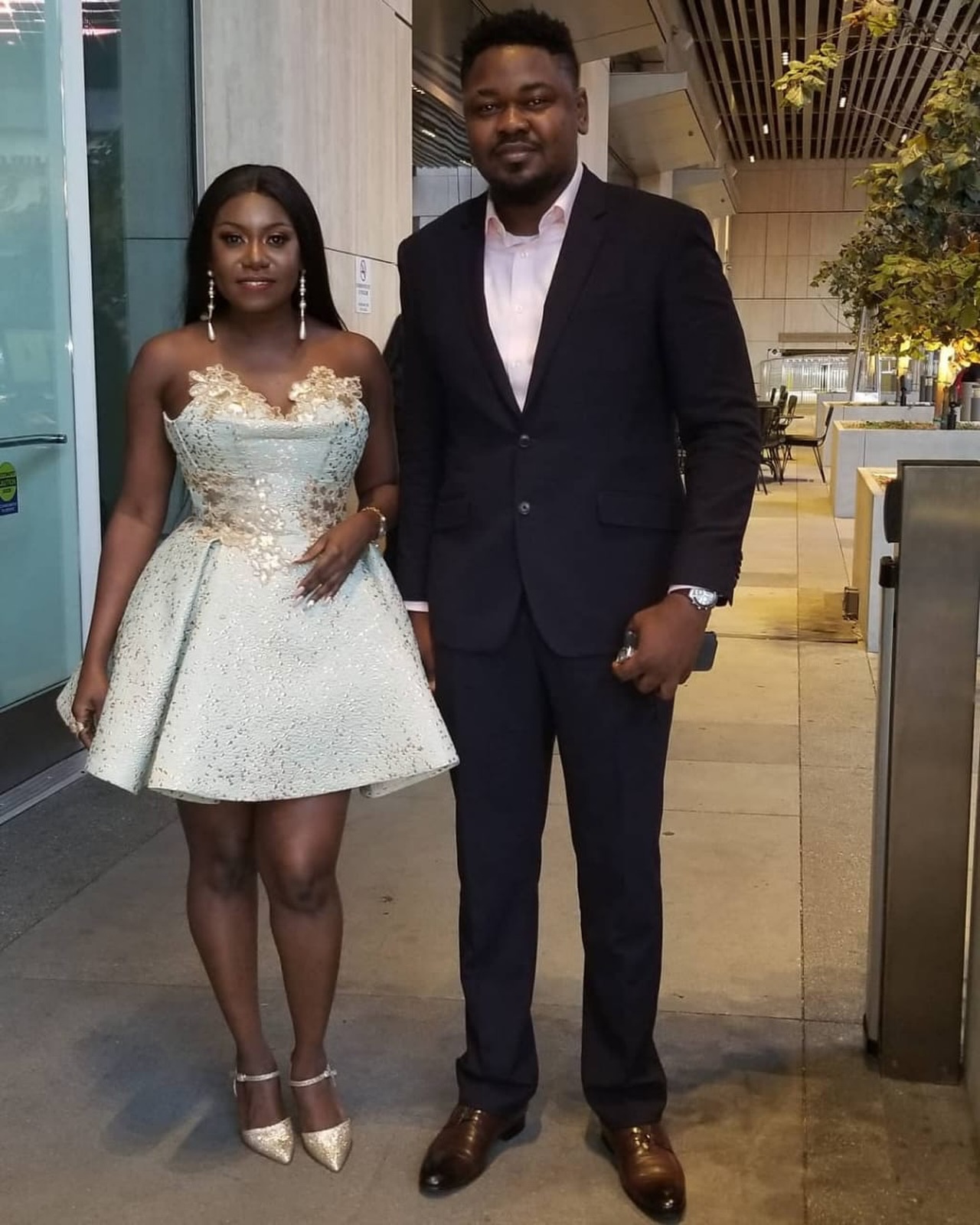 Niniola posing alongside her late husband and manager Michael Ndika at a formal event.