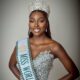 Tamunosoye Karibi-George smiling wearing a jewelled crown, a heavily embellished silver gown, and the Miss World Nigeria sash.