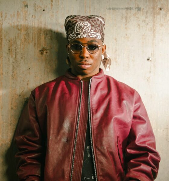 Fola wearing a bandana, sunglasses, and red leather jacket following his 10 nominations at the 2026 Headies Awards.