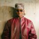 Fola wearing a bandana, sunglasses, and red leather jacket following his 10 nominations at the 2026 Headies Awards.